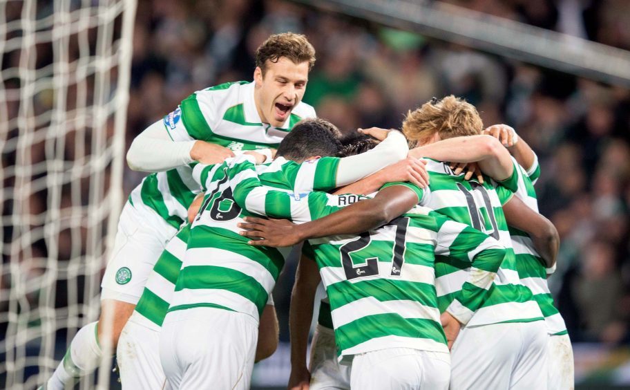 Celtic's Moussa Dembele celebrates scoring his sides third goal with team mates during the Scottish League Cup Final at Hampden Park, Glasgow.