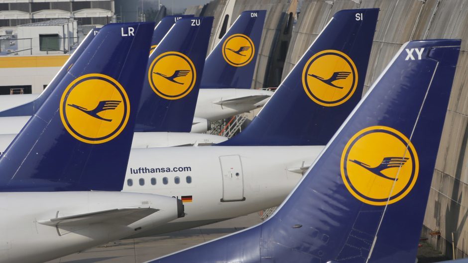 Row of Lufthansa aircraft tails with crane logo.