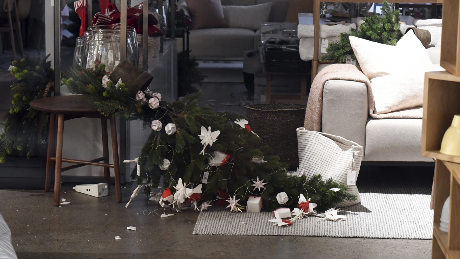 A Christmas tree lies on its side in a shop in Wellington (Ross Setford/SNPA via AP)