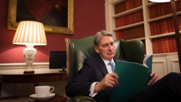 Chancellor of the Exchequer Philip Hammond reads through his Autumn Statement in his office in 11 Downing Street