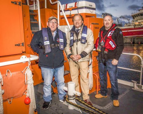 New RNLI Chairman Stuart Popham, Coxswain Vic Sutherland and new Lifeboat Operations Manager Hamish Partridge