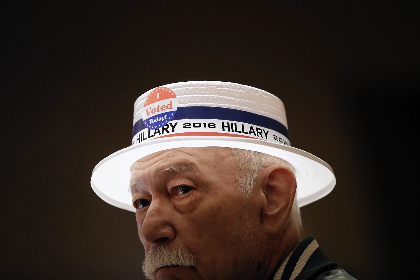Julio Jacot wears a hat in support of Democratic presidential candidate Hillary Clinton at an election night watch party Tuesday, Nov. 8, 2016, in St. Louis. (AP Photo/Jeff Roberson)