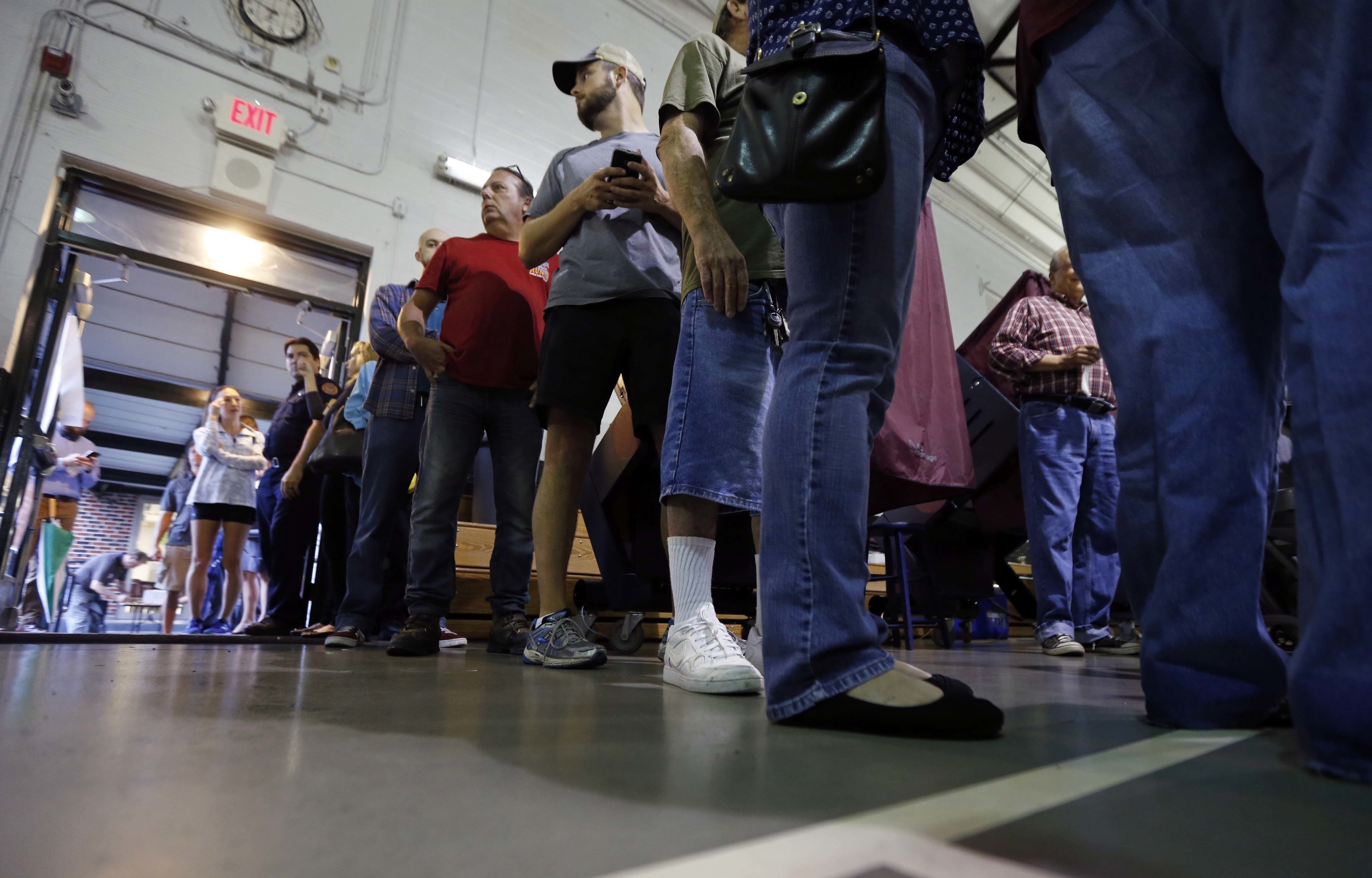 People stand in line to vote at St. Dominic's School on Election Day in the Lakeview section of New Orleans,