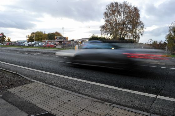 Picture shows a car on the A96 near Forres.