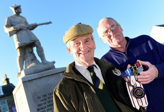 Deputy Lieutenant Mike Taitt (left) had his medals returned to him by Jim Leask after he lost them on remembrance sunday.     
Picture by Kami Thomson
