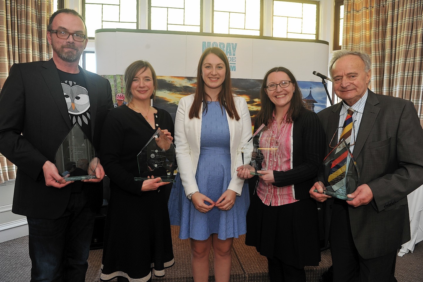 Chamber chief executive Sarah Medcraf, centre, with the award winners, L-R: Stuart Cox, I Like Birds, Kresanna Aigner, Findhorn Bay Arts, Alison Rose, Spey Bay Whale and Dolphin Centre, and George Goudsmit, AES Solar.