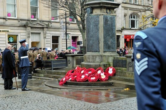 Elgin Remembrance Sunday parade to the War Memorial on the Plainstones, Elgin.
Picture by Gordon Lennox