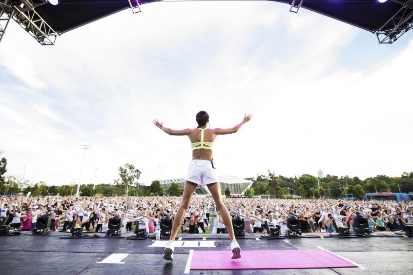 Personal trainer Kayla Itsines achieving the Guinness World Record for the most people star jumping, which is is 2192