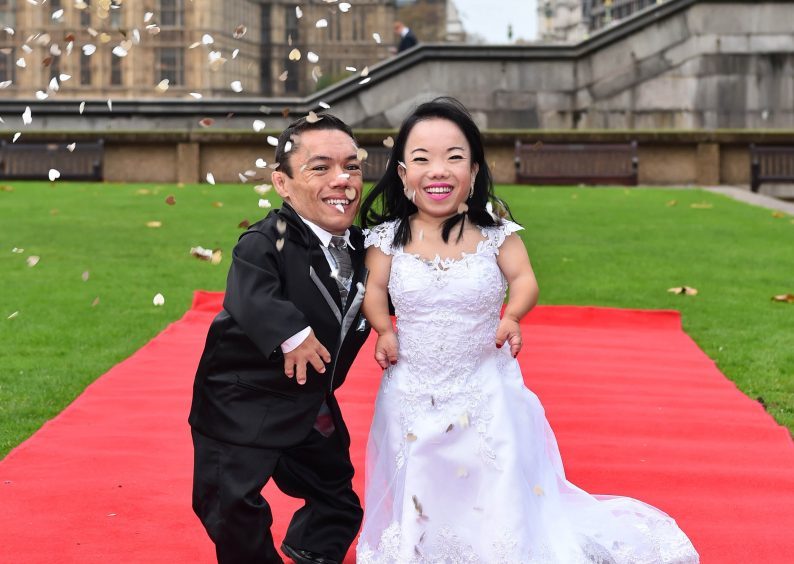Paulo Gabriel da Silva Barros and Katyucia Lie Hoshino Barros from Brazil are presented with the Guinness World Record, which confirms they are The WorldÕs Shortest Married Couple, marking Guinness World Records Day