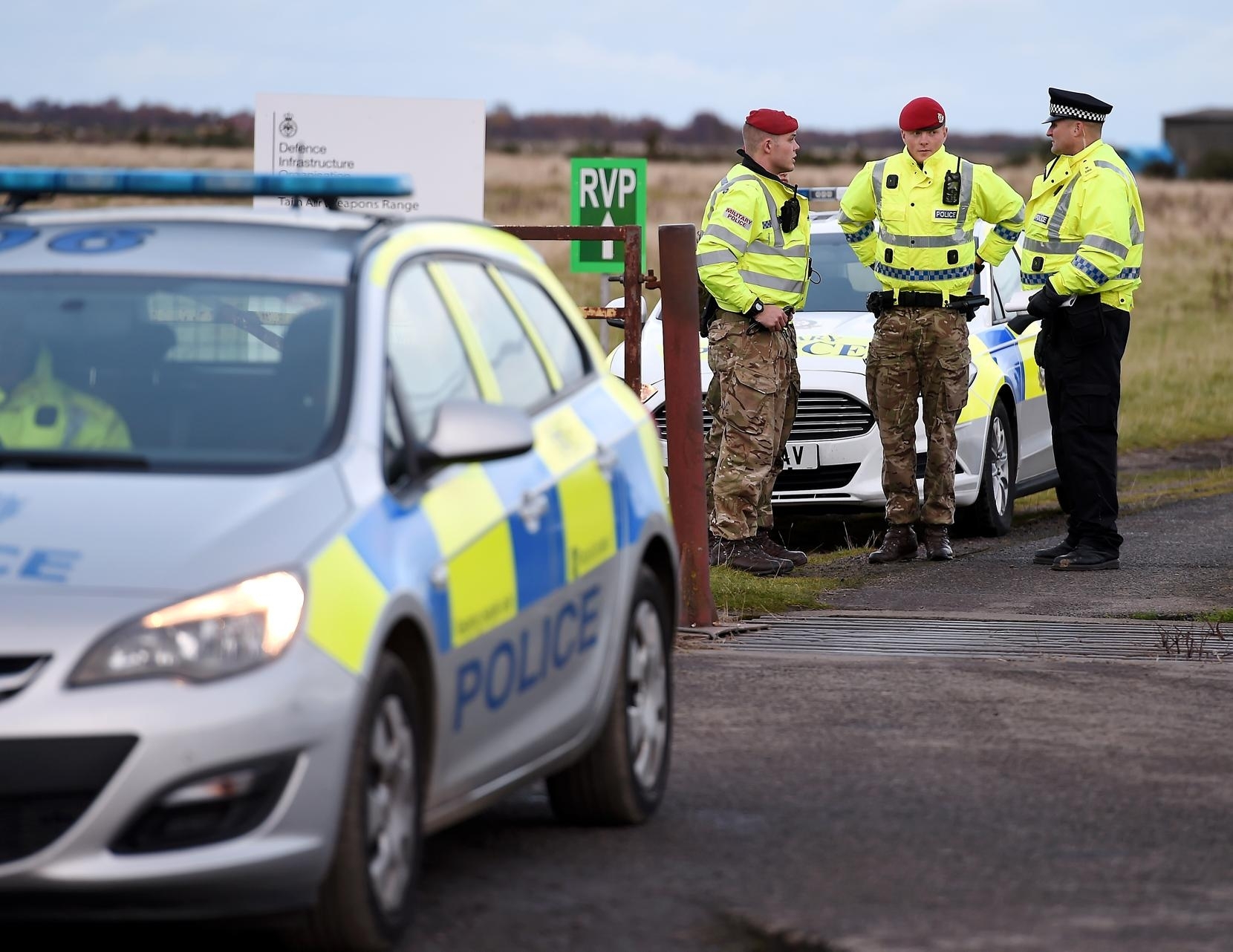 Police Scotland and Military Police at the gates to the ranges in Tain after the incident.