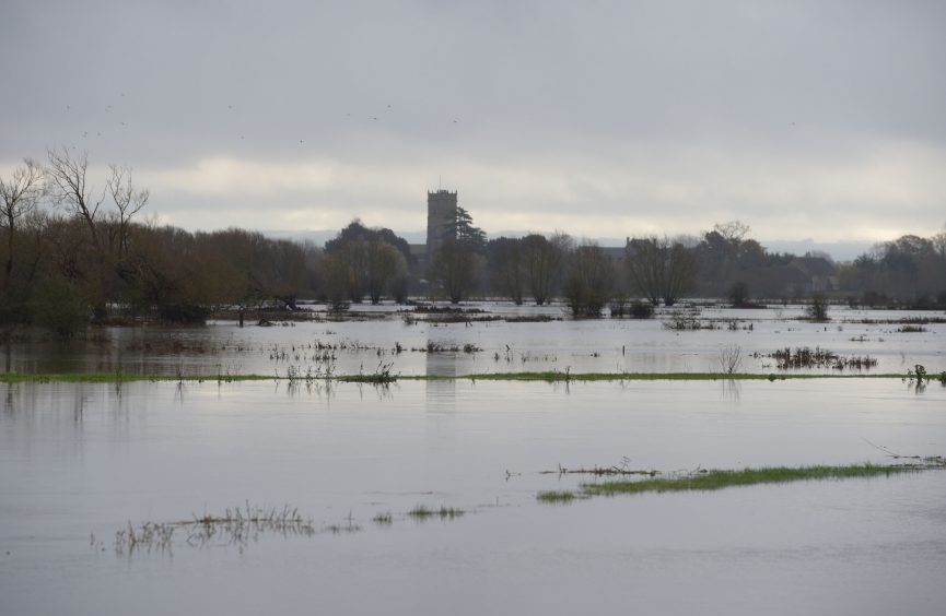 Flooding on the Somerset Levels in front of Muchelney Abbey as heavy rain, strong winds and flash flooding have brought widespread disruption across the country.