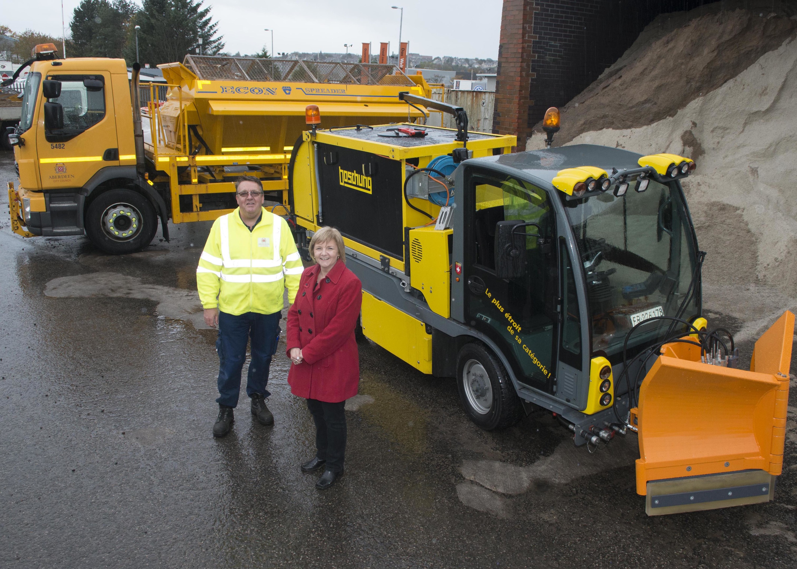 04/11/16 Councillor Jenny Laing and gritter driver Gordon Walters with gritting equipment at Tullos Road Depot
