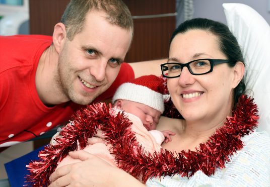Lisa and Andrew Urquhart from Banchory with baby Ailie born at 12.08am on Christmas Day at Aberdeen Maternity Hospital. 
Picture by Kevin Emslie