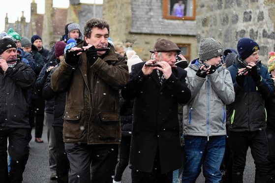 The flute band leads the walkers through Inverallochy