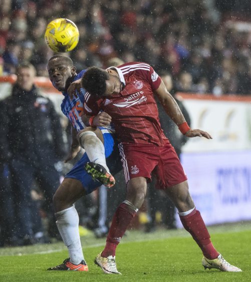 Kilmarnock's Souleymane Coulibaly (L) and Aberdeen's Shay Logan (R)