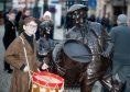 Drummer boy Owen Thomson, 12, led a procession to the new statues that have been unveiled in Elgin's town centre.