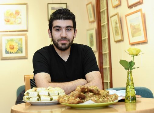 Moyhamed Dured Alahalabe at a Amal Committee gathering held at West Parish Church, Inverurie.