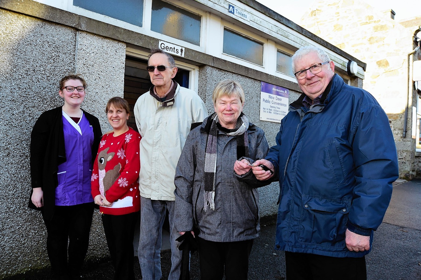 Councillor Norman Smith hands over the keys to residents