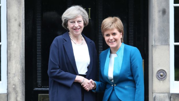 Theresa May, left, and First Minister Nicola Sturgeon
