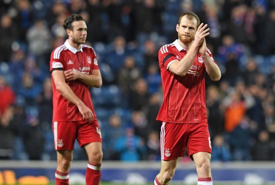 Aberdeen's Mark Reynolds applauded the supporters at full time after Rangers defeat
