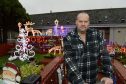 Robert Russell of Oldtown Road, Inverness has had his garden Santas Grotto shut down by Highland Council.