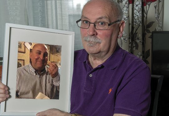 Ronnie Semple with a photograph of his brother Gordon