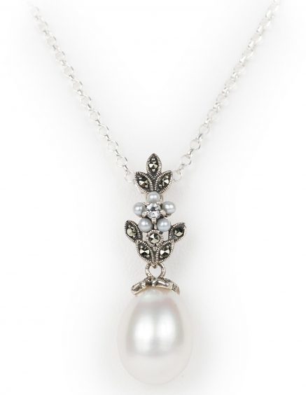 Teardrop pearl suspended from a seed pearl flower with marcasite leaves £55