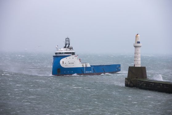 A offshore supply vessel struggling with the conditions on its return to Aberdeen Harbour.