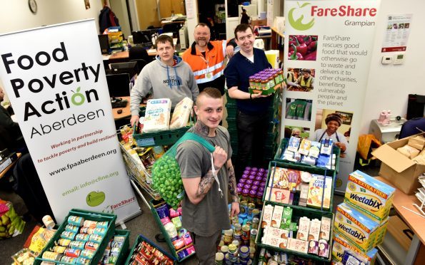 Kris Marr (store person) (front) with (back, from left)  Stewart Linton (volunteer), Donald Ross (volunteer drivere), Kris Marr (store person) and James Welsh (training Kitchen assistant).
Picture by Colin Rennie