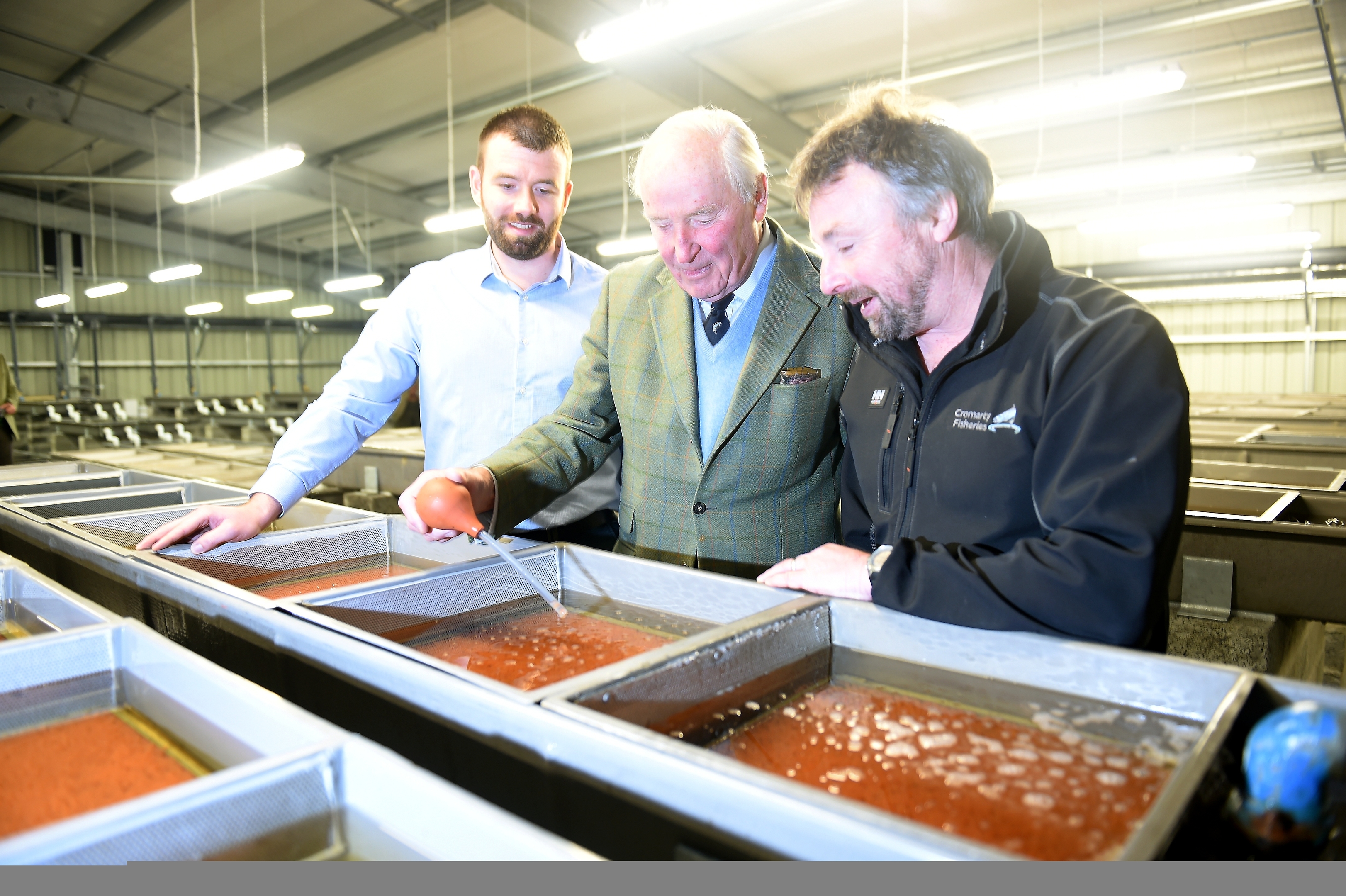 Lord Nickson, (centre) with Michael Jack, Civil Engineer with SSE and Simon McKelvey (right) Director of the Cromarty Firth Fisheries Board in the new facilities.