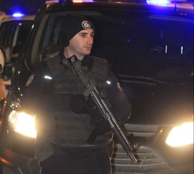 Turkish police officers secure the area close to a photo gallery where the Russian Ambassador to Turkey, Andrei Karlov, was shot by a gunman in Ankara, Turkey, Monday, Dec. 19, 2016. A Russian official says that the country's ambassador to Turkey has died after being shot by a gunman in Ankara. (IHA photo via AP)