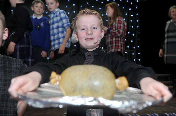 New Elgin Primary School pupil Jack Granitza gave a lively address to the haggis.