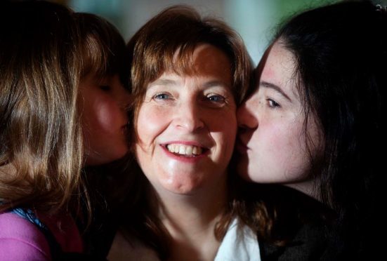 Doreen McClelland-Jones with daughters Siena, left, and Alina, right, has no doubts she would have died if CPR was not performed on her.