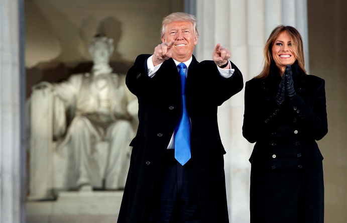 President-elect Donald Trump, left, and his wife Melania Trump arrive to the "Make America Great Again Welcome Concert" at the Lincoln Memorial