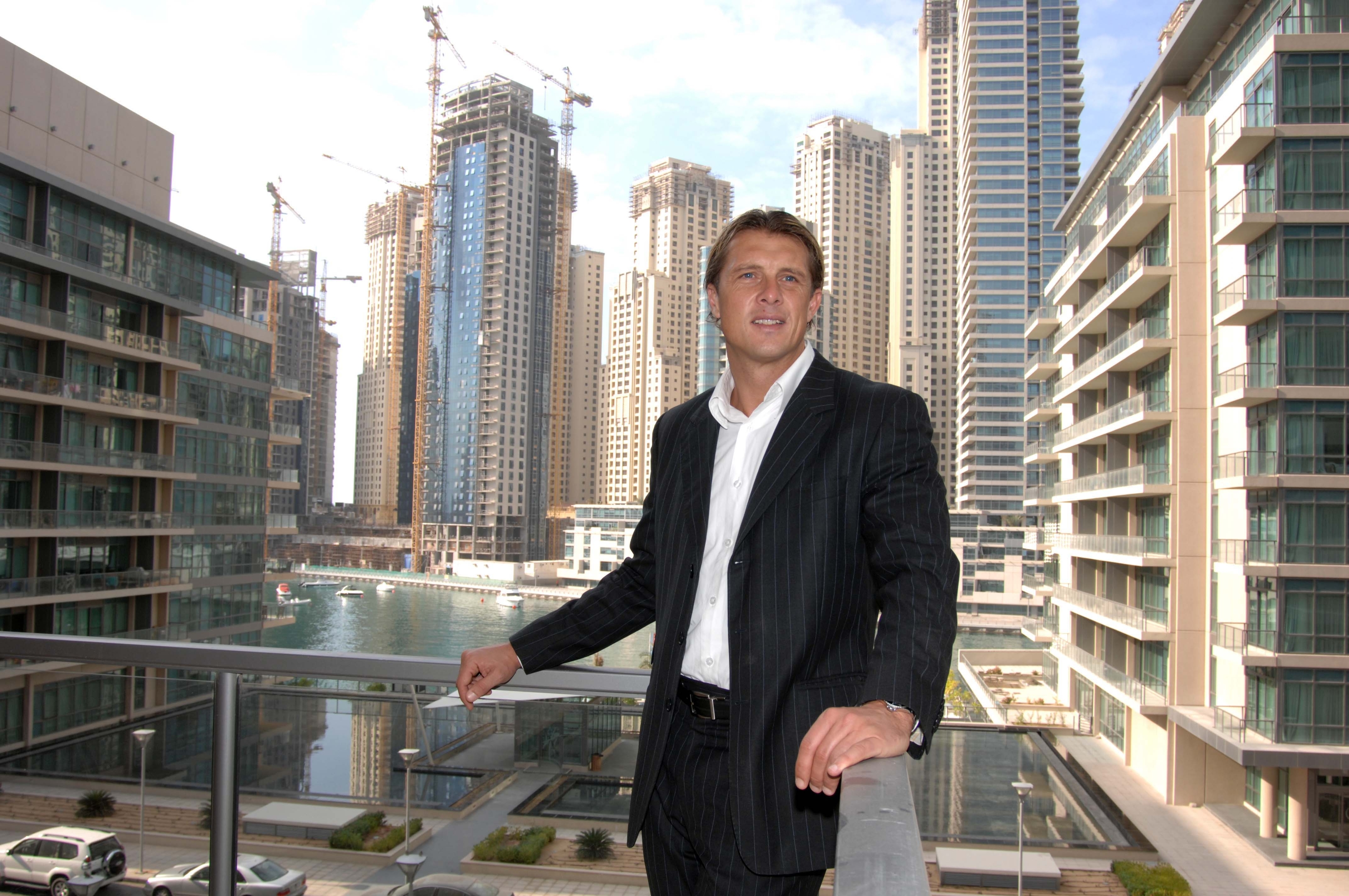 Derek Whyte, on the balcony of his home in Dubai Marina