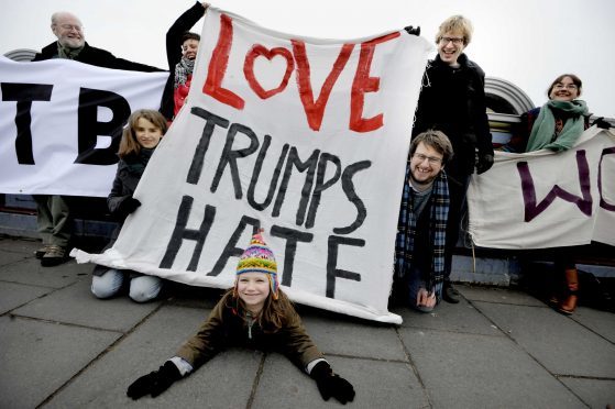 Banners on North Bridge in Edinburgh as part of the Bridges Not Walls protest against US President Donald Trump on the day of his inauguration.