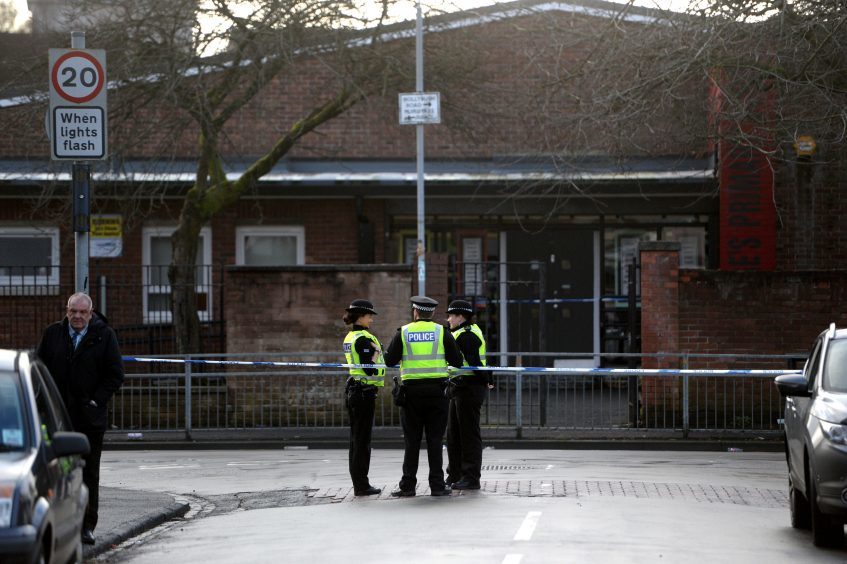 Police at the scene of a shooting that happened near St Georges RC Primary School where children were being dropped off in the morning.