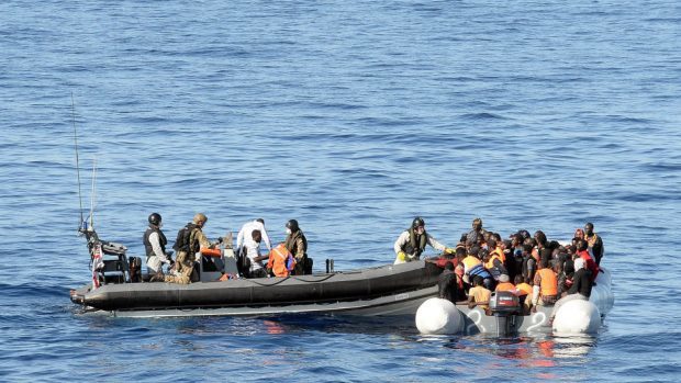A Royal Navy crew assisting a boat of migrants in the Mediterranean (MoD/PA)