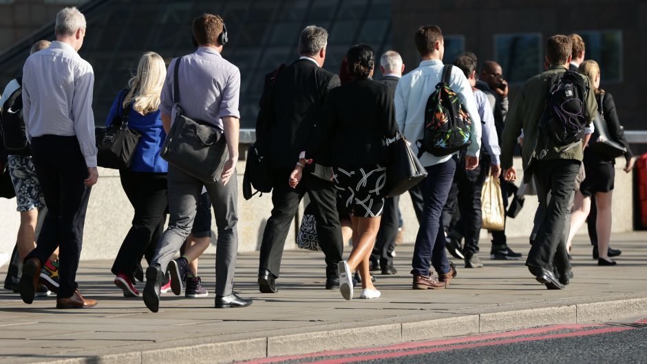 City workers walking along London Bridge before the pandemic.
