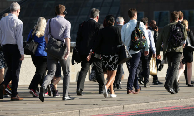 City workers walking along London Bridge before the pandemic.