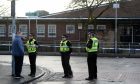 Police at the scene of a shooting that took place near St Georges RC Primary School