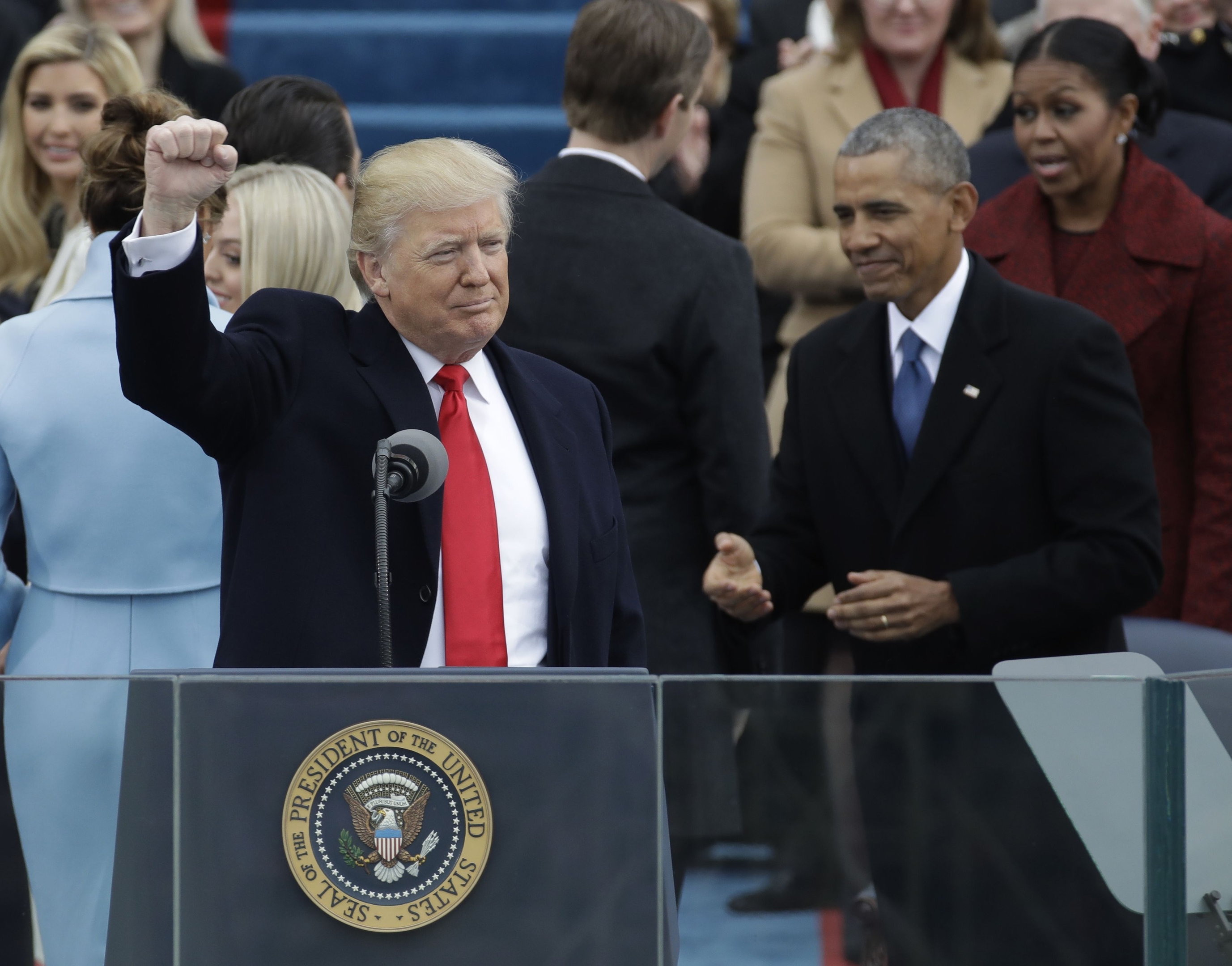 President Donald Trump waves after being sworn in as the 45th president of the United States