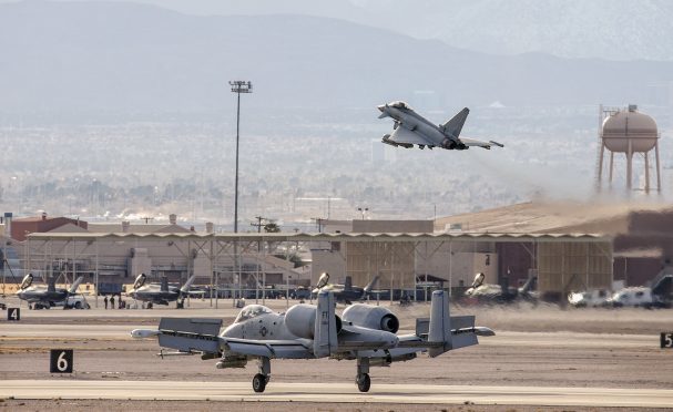 A Typhoon from RAF Lossiemouth's 6 Squadron takes to the sky as a US Air Force A10 Thunderbolt lands on the parallel runway.