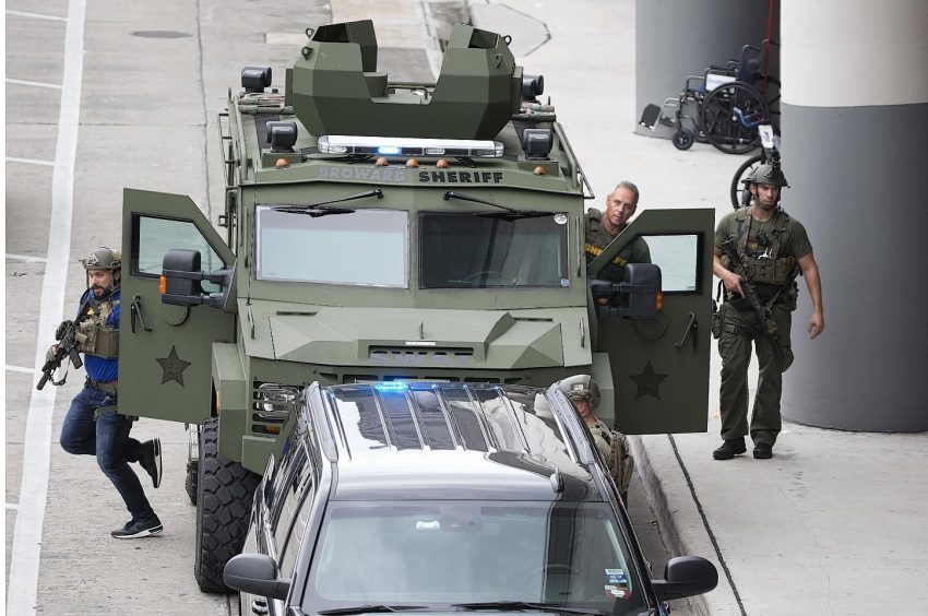 Law enforcement personnel arrive in an armored car outside Fort Lauderdale–Hollywood International Airport,