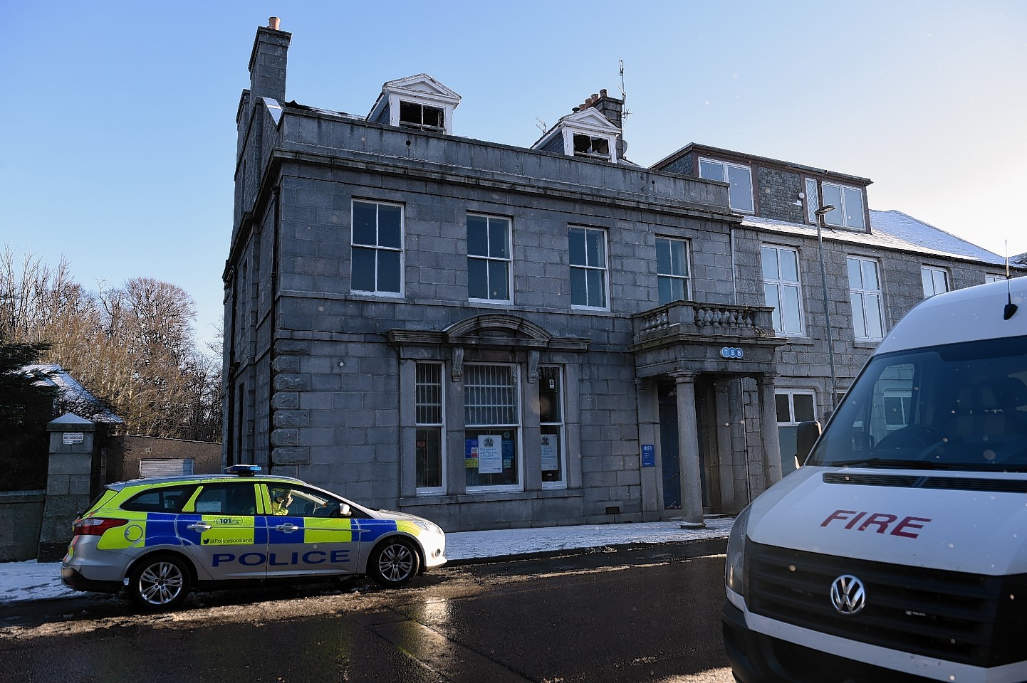 Police remain at the scene of the TSB fire in Insch. (Picture: Kenny Elrick)