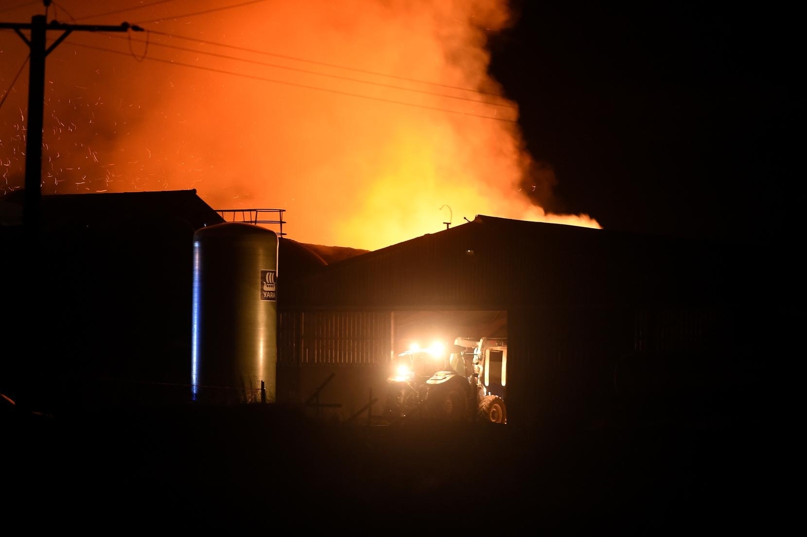 The scene of farm fire at Nigg in Easter Ross which is believed to have involved a combine harvester and a large quantity of bales. Pics by Sandy McCook.