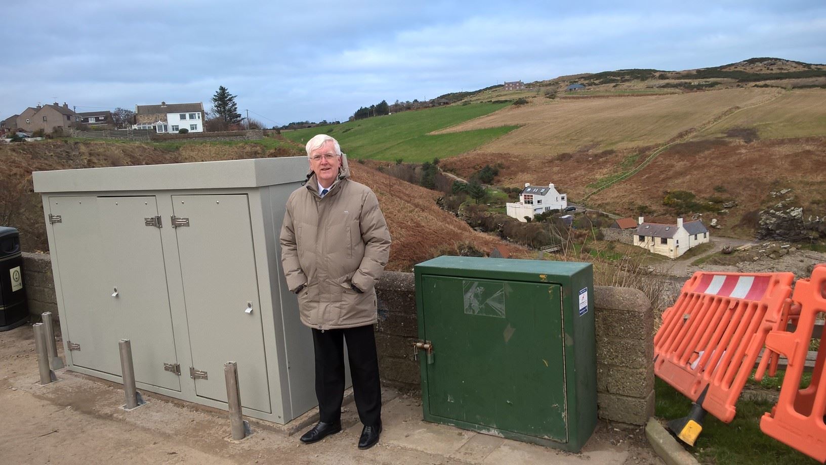 Councillor Ian Mollison stands next to the huge eyesore overlooking Newtonhill Bay