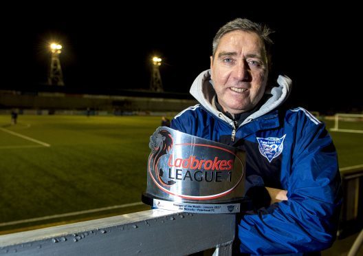 Jim McInally receives his Ladbrokes League One manager of the month award for January.