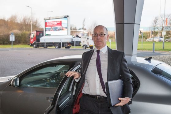 The van and Mr Swinney. Picture: Newsline