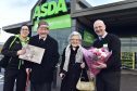 FRASERBURGH COUPLE BOB AND GINA MCDONALD RECEIVE GIFTS FROM ASDA MANAGER EDY YOUNG AND COMMUNITY CHAMPION CAROLYN TAYLOR TO MARK THEIR 70TH WEDDING ANNIVERSARY